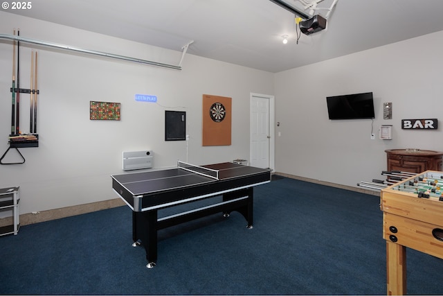 game room with dark colored carpet