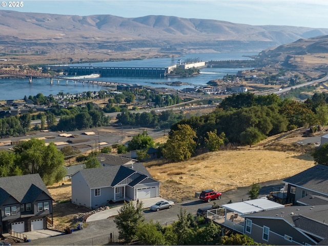 aerial view featuring a water and mountain view