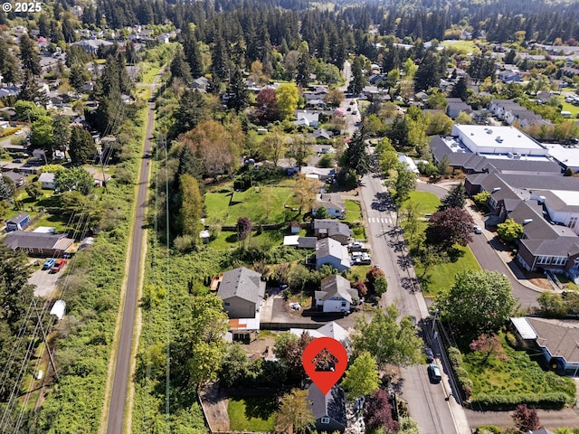 birds eye view of property with a residential view