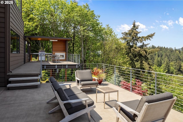 view of patio with grilling area and outdoor lounge area