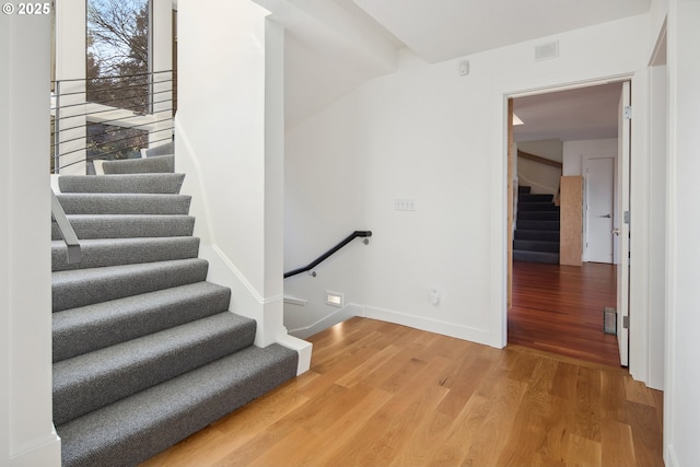 stairs with wood-type flooring