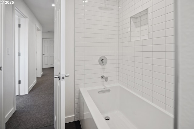 bathroom featuring tiled shower / bath combo