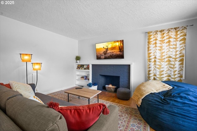 1637 Camino Dr, Forest Grove, OR 97116 - living room with a textured ceiling, wood finished floors, a fireplace, and baseboards