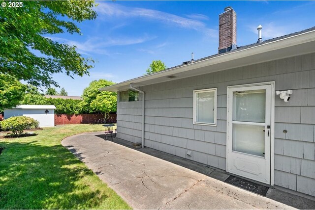 1637 Camino Dr, Forest Grove, OR 97116 - view of home's exterior featuring a patio and a chimney