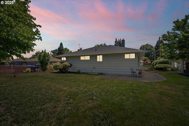 1637 Camino Dr, Forest Grove, OR 97116 - back of property at dusk with a patio