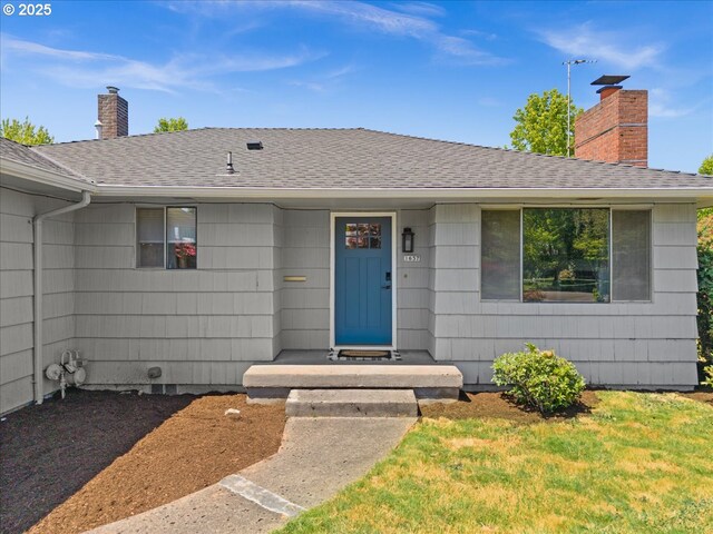 1637 Camino Dr, Forest Grove, OR 97116 - view of front of house with a chimney and a shingled roof