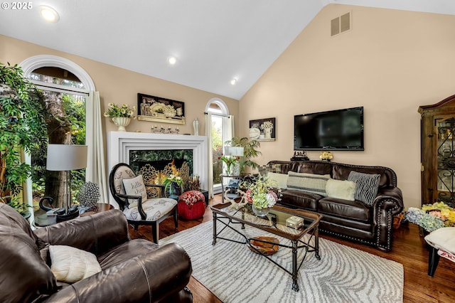 3420 SE 144th Ct, Vancouver, WA 98683 - living area with wood finished floors, high vaulted ceiling, recessed lighting, and a fireplace
