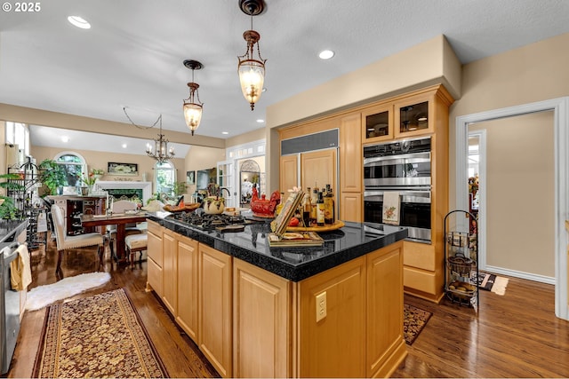 3420 SE 144th Ct, Vancouver, WA 98683 - kitchen featuring stainless steel double oven, dark wood-type flooring, light brown cabinetry, tile counters, and recessed lighting