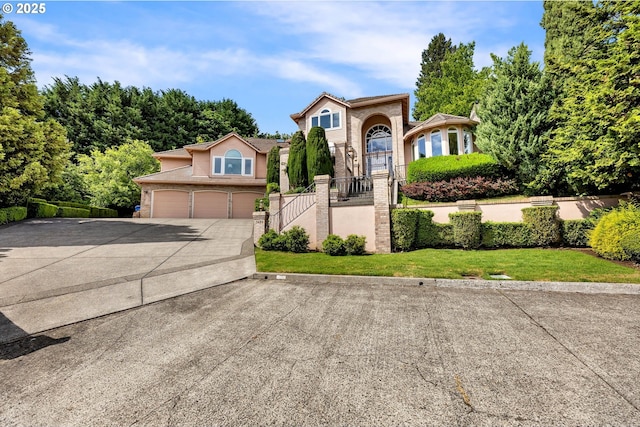 3420 SE 144th Ct, Vancouver, WA 98683 - view of front facade featuring driveway, a garage, stairway, and a front lawn