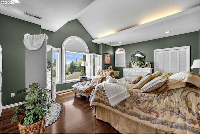 3420 SE 144th Ct, Vancouver, WA 98683 - bedroom with lofted ceiling, baseboards, dark wood-type flooring, recessed lighting, and a textured ceiling