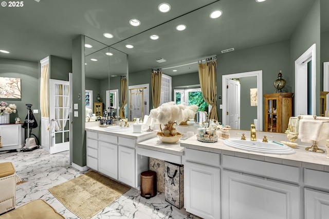 3420 SE 144th Ct, Vancouver, WA 98683 - bathroom featuring recessed lighting, double vanity, and marble finish floors