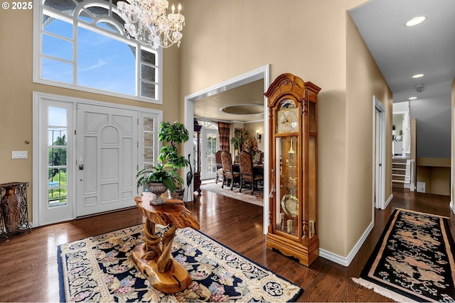 3420 SE 144th Ct, Vancouver, WA 98683 - foyer entrance featuring dark wood-type flooring, a towering ceiling, a chandelier, and baseboards