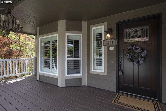 entrance to property featuring covered porch