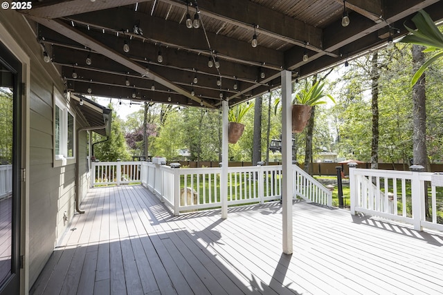 wooden deck featuring fence