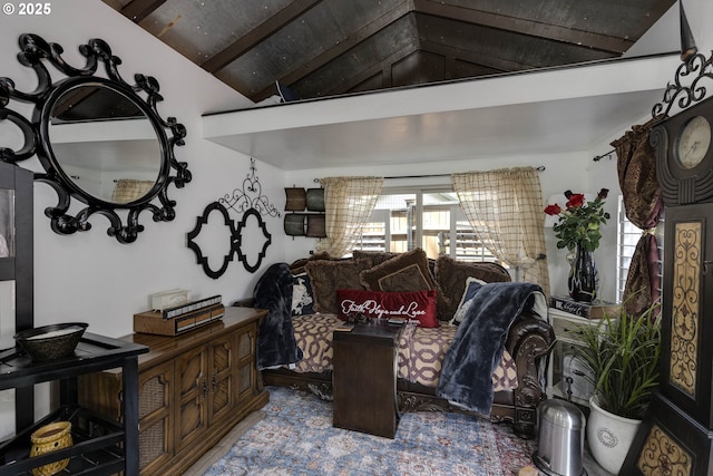 interior space featuring vaulted ceiling with beams
