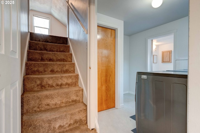 stairs featuring washer / clothes dryer