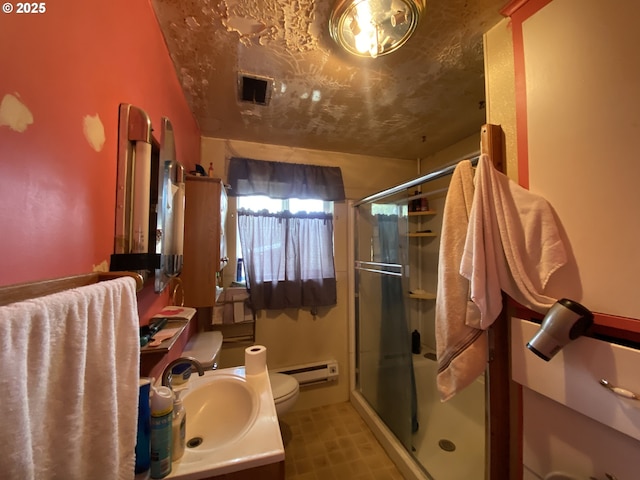 35001 Seavey Loop Rd, Eugene, OR 97405 - full bathroom with a shower stall, baseboard heating, and vanity