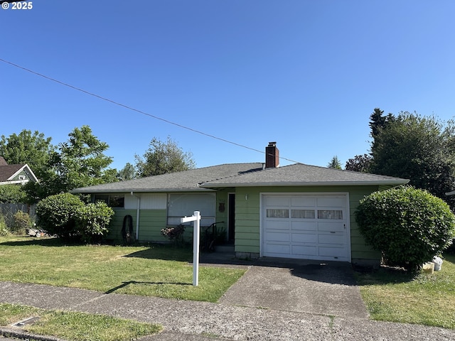 3032 NW Grant Ave, Corvallis, OR 97330 - view of front of home featuring a front yard, concrete driveway, a chimney, and a garage