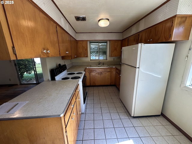 3032 NW Grant Ave, Corvallis, OR 97330 - kitchen featuring white appliances, brown cabinets, light countertops, and light tile patterned floors