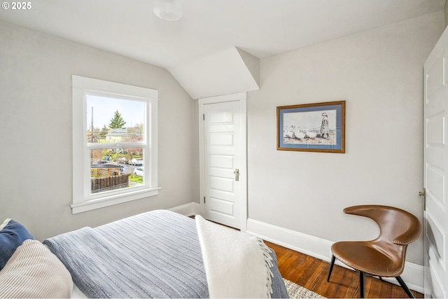 bedroom featuring wood finished floors and baseboards