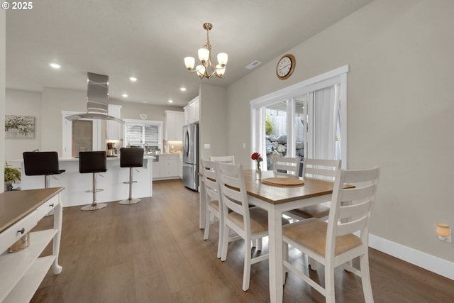 3783 Rockcress Rd, Eugene, OR 97403 - dining area with a chandelier, light wood-type flooring, plenty of natural light, and recessed lighting