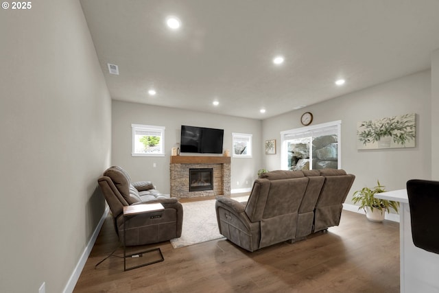 3783 Rockcress Rd, Eugene, OR 97403 - living room with baseboards, a stone fireplace, wood finished floors, and recessed lighting