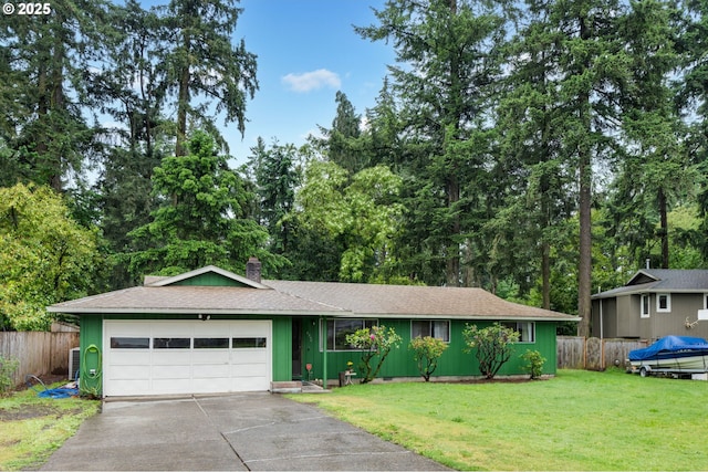 ranch-style house featuring driveway, an attached garage, and a chimney