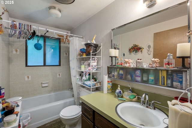bathroom featuring toilet, shower / bath combo, and vanity