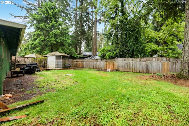 view of yard with an outbuilding and a shed