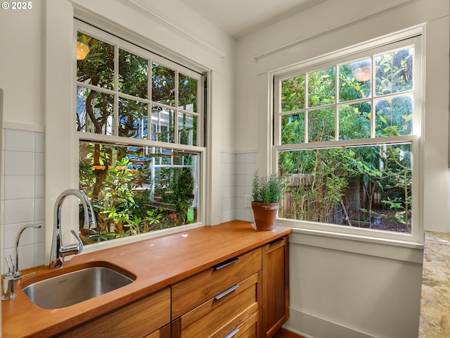 doorway to outside featuring a sink