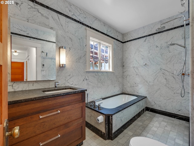 full bath with tile walls, a marble finish shower, vanity, a bath, and toilet