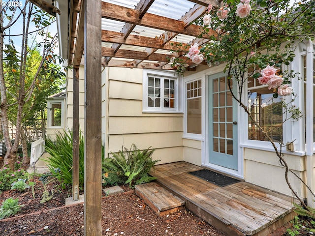 entrance to property featuring a pergola