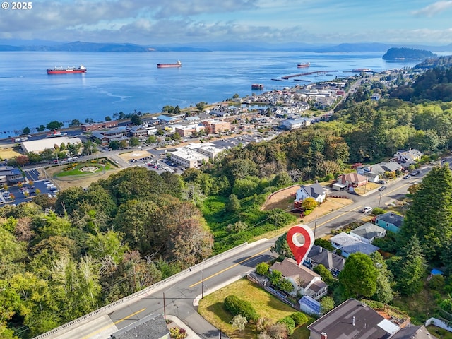 aerial view of property's location featuring a nearby body of water