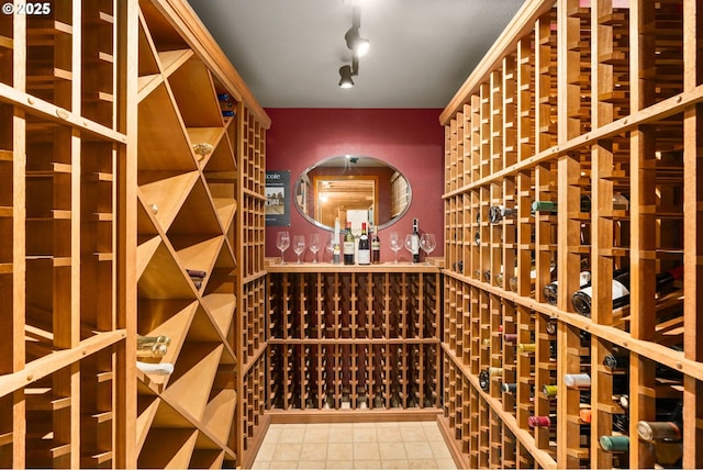 wine area featuring tile patterned flooring