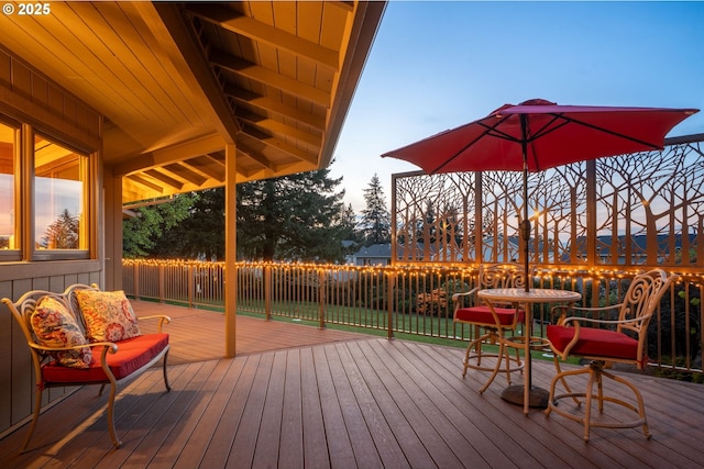 deck at dusk with fence