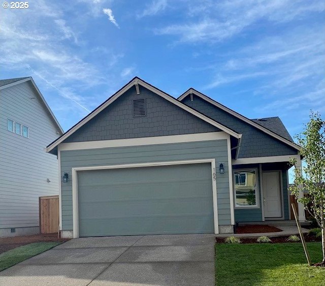 view of front of house with driveway and an attached garage