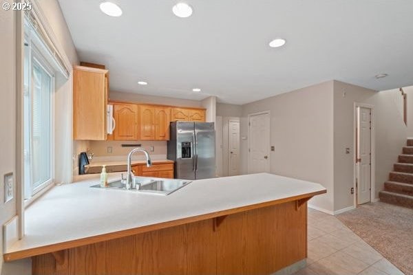 17504 SE 16th Cir, Vancouver, WA 98683 - kitchen with stainless steel fridge with ice dispenser, a peninsula, a sink, white microwave, and light countertops