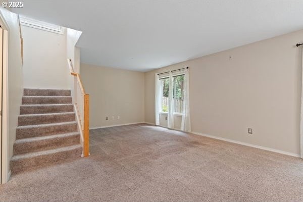 17504 SE 16th Cir, Vancouver, WA 98683 - unfurnished living room featuring carpet, baseboards, and stairs