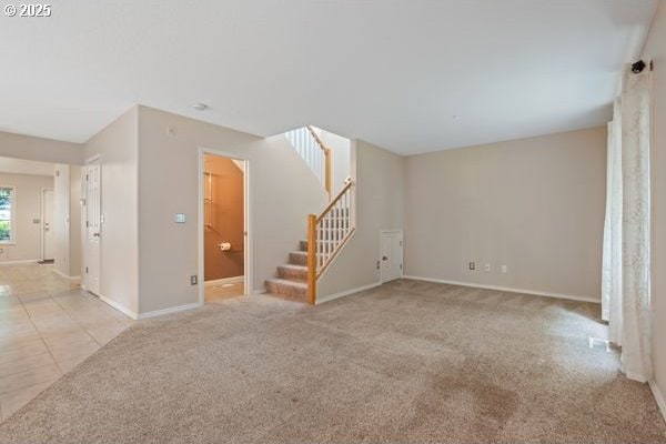 17504 SE 16th Cir, Vancouver, WA 98683 - unfurnished living room featuring stairs, baseboards, and carpet