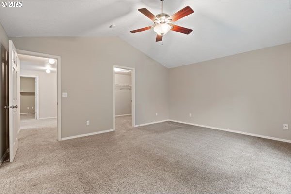 17504 SE 16th Cir, Vancouver, WA 98683 - unfurnished bedroom featuring lofted ceiling, a walk in closet, carpet floors, and baseboards