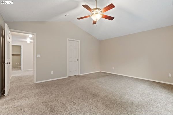 17504 SE 16th Cir, Vancouver, WA 98683 - unfurnished bedroom featuring vaulted ceiling, carpet flooring, baseboards, and ceiling fan