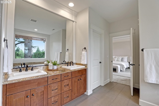 1734 NW Saltzman Rd, Portland, OR 97229 - ensuite bathroom featuring double vanity, baseboards, and tile patterned flooring