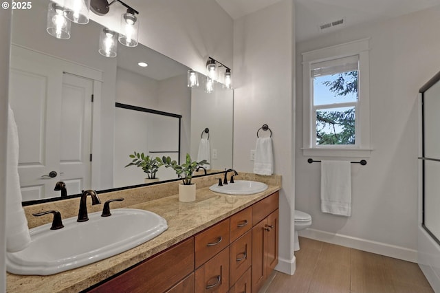 1734 NW Saltzman Rd, Portland, OR 97229 - bathroom with baseboards, toilet, double vanity, and a shower