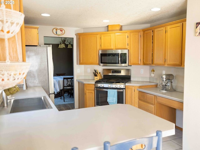 3135 SE 26th St, Gresham, OR 97080 - kitchen featuring appliances with stainless steel finishes, light countertops, recessed lighting, and light tile patterned floors
