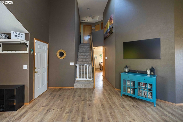 3135 SE 26th St, Gresham, OR 97080 - unfurnished living room with a towering ceiling, wood finished floors, and stairway
