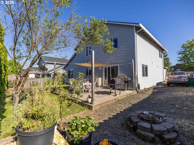 3135 SE 26th St, Gresham, OR 97080 - back of property with an outdoor fire pit and a patio