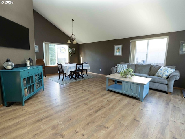 3135 SE 26th St, Gresham, OR 97080 - living area with healthy amount of natural light, light wood-style floors, and high vaulted ceiling