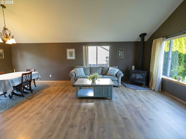 3135 SE 26th St, Gresham, OR 97080 - living area with lofted ceiling, light wood-type flooring, a wood stove, and a chandelier