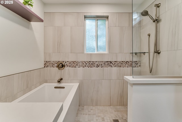 full bath featuring walk in shower and a bath