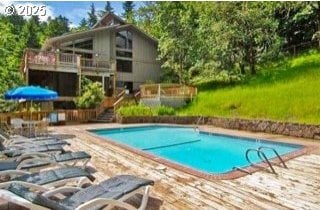 community pool featuring a wooden deck